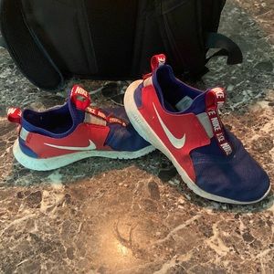 2 pair of kids Nike flex runners